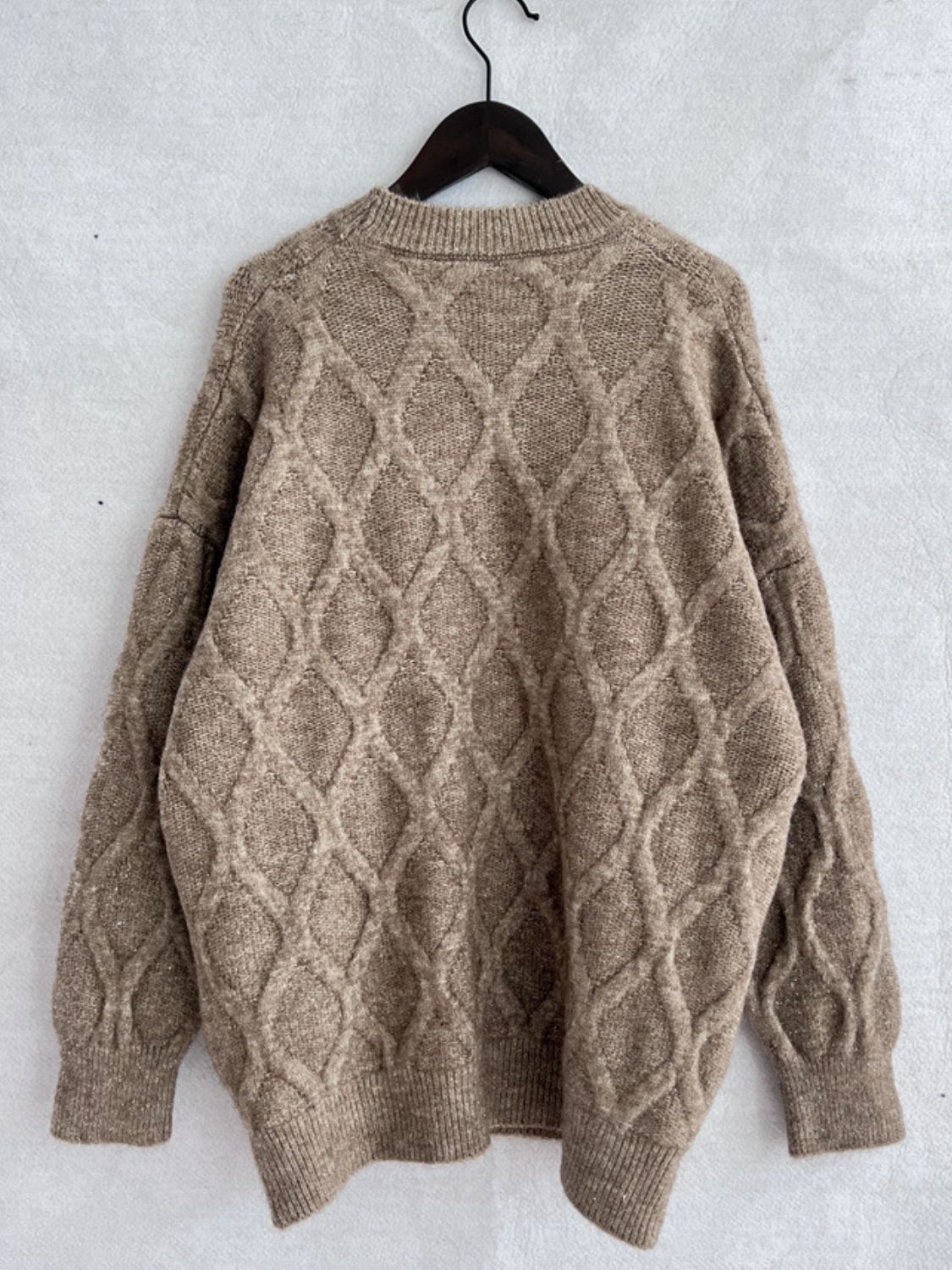 Sparkle knit relaxed fit sweater in beige with diamond cable knit pattern and crewneck.
