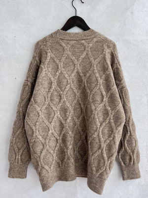 Sparkle knit relaxed fit sweater in beige with diamond cable knit pattern and crewneck.