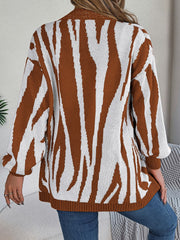 Caramel and white zebra stripe open-front knit cardigan with long sleeves.