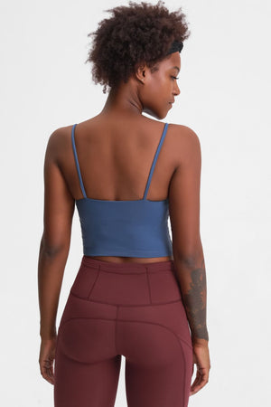 Light blue scoop neck crop tank top with thin straps, shown from the back.
