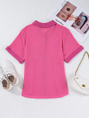 Waffle-knit button-down shirt in cerise with short sleeves and a collar.