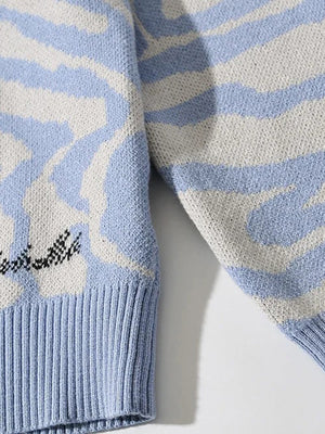 Misty Blue Orca Motif Knit V-Neck Sweater with ribbed cuffs and hem