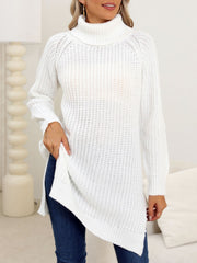 White knit turtleneck sweater with an asymmetric hemline and ribbed texture.
