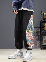 Black joggers with vibrant side panel print and elastic cuffs