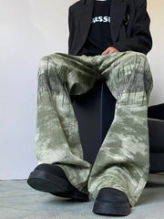 Abstract print wide-leg jeans in green with black graphic detail.