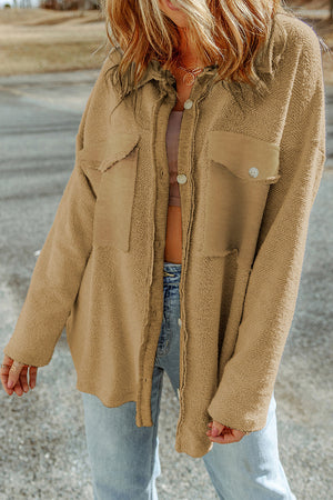 Camel textured shacket with raw edge detailing and buttoned pockets.