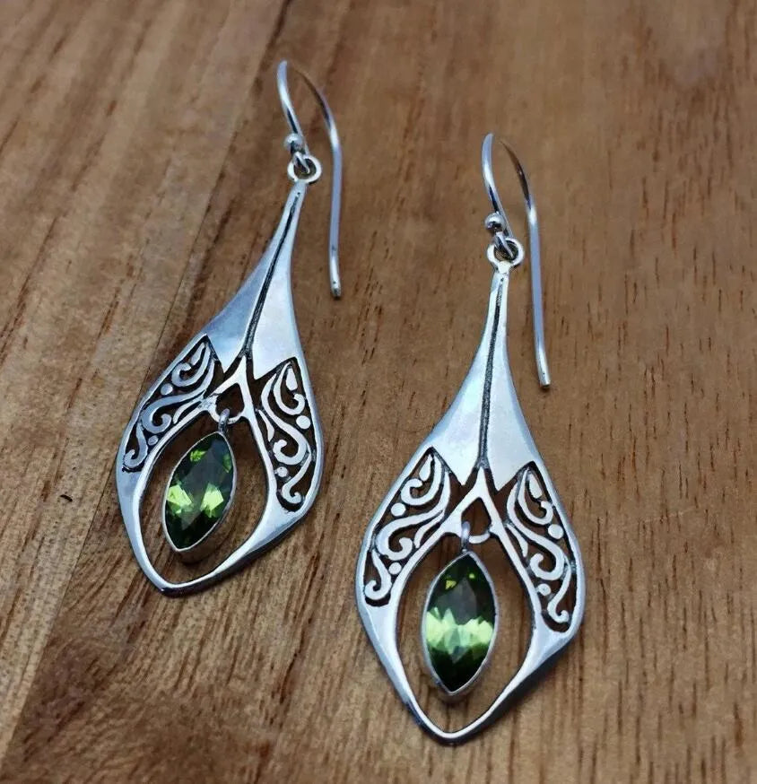 Silver filigree pear-drop earrings with green peridot gemstone