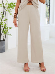 Beige waffle knit wide-leg pants with a comfortable fit.