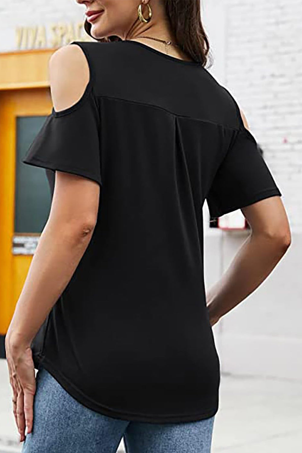 Black cold shoulder top with flutter sleeves and a V-neck.
