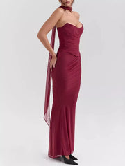 Burgundy sweetheart ruched maxi dress with sheer scarf detail.