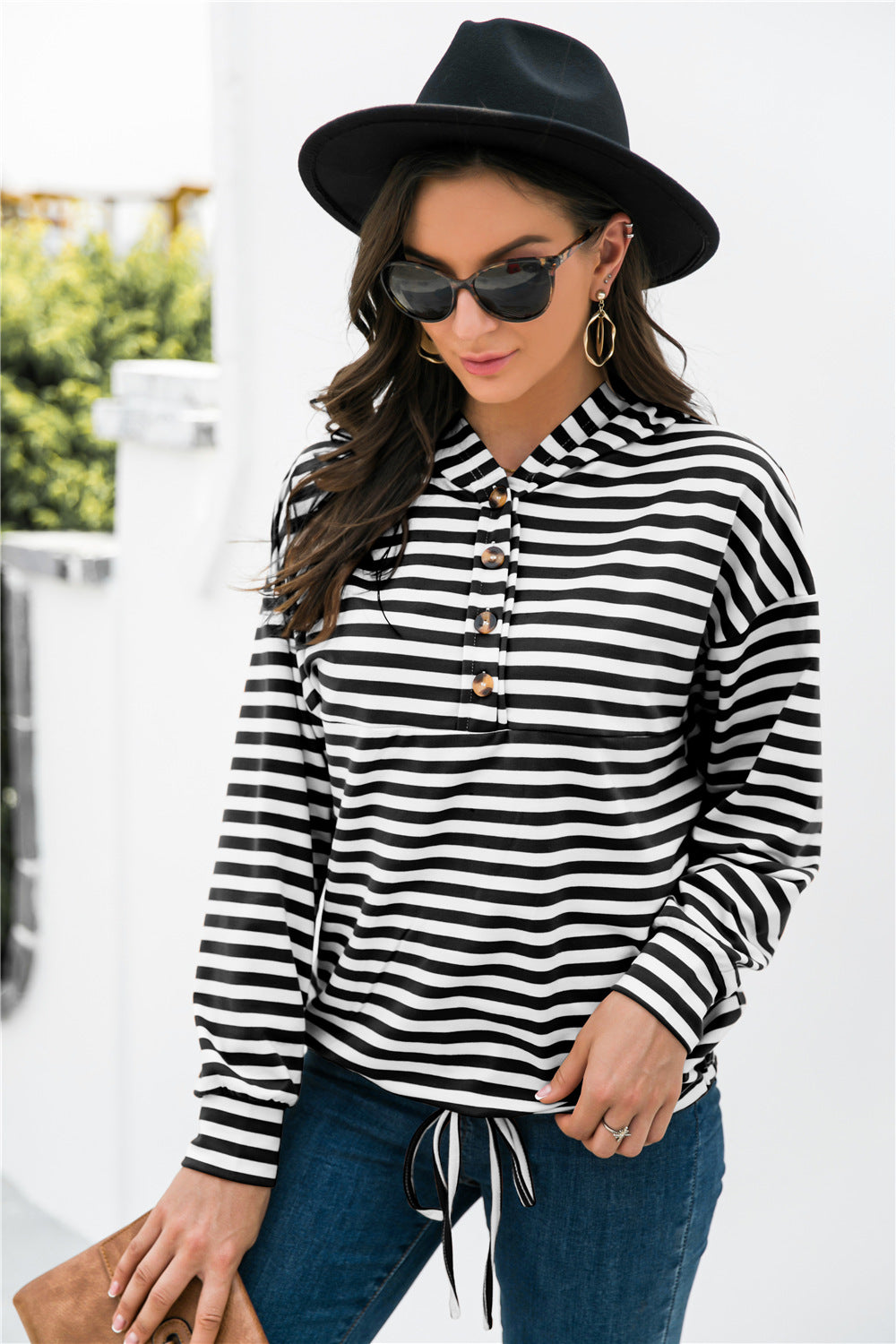 Black and white striped hoodie with button neck detail and drawstring waist