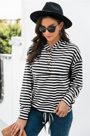 Black and white striped hoodie with button neck detail and drawstring waist