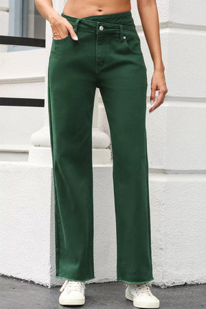 Green cotton jeans with crossed v-waist and straight leg, frayed hem.