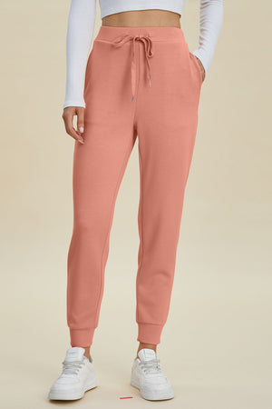 Coral joggers with drawstring waist and cuffed ankles