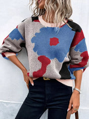 Abstract floral knit sweater with round neck in blue, red, black, and gray.