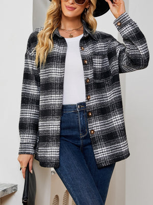 Black and white plaid shacket with oversized button detail and chest pockets.
