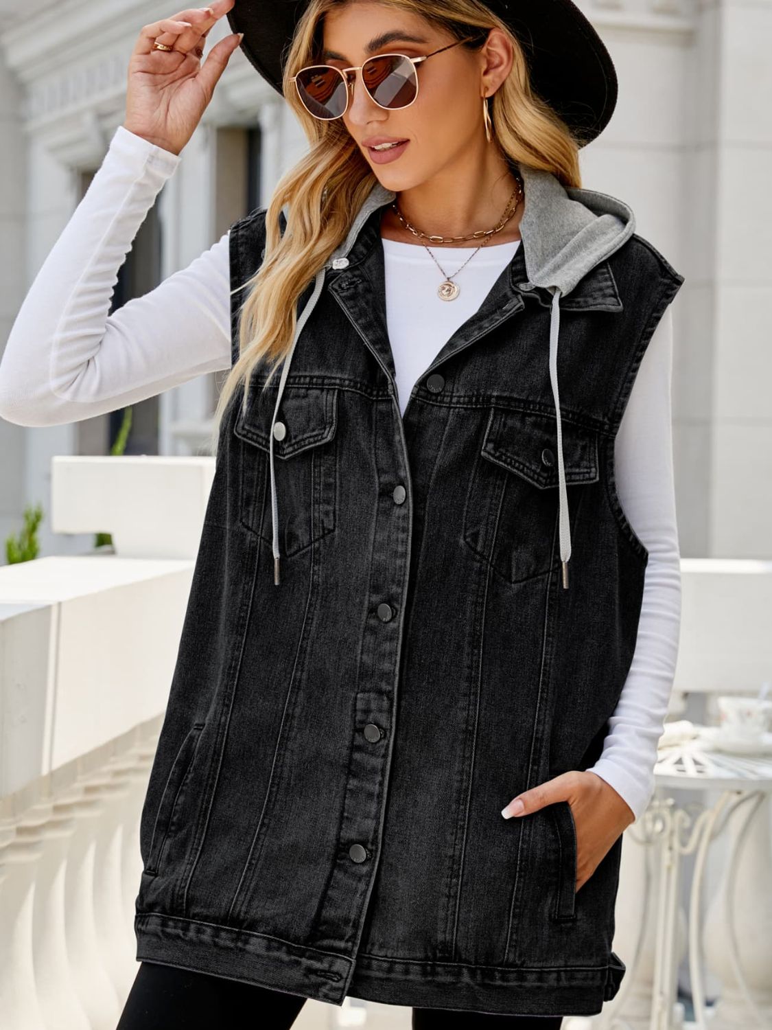 Dark denim hooded vest with contrast lining and drawstring hood.