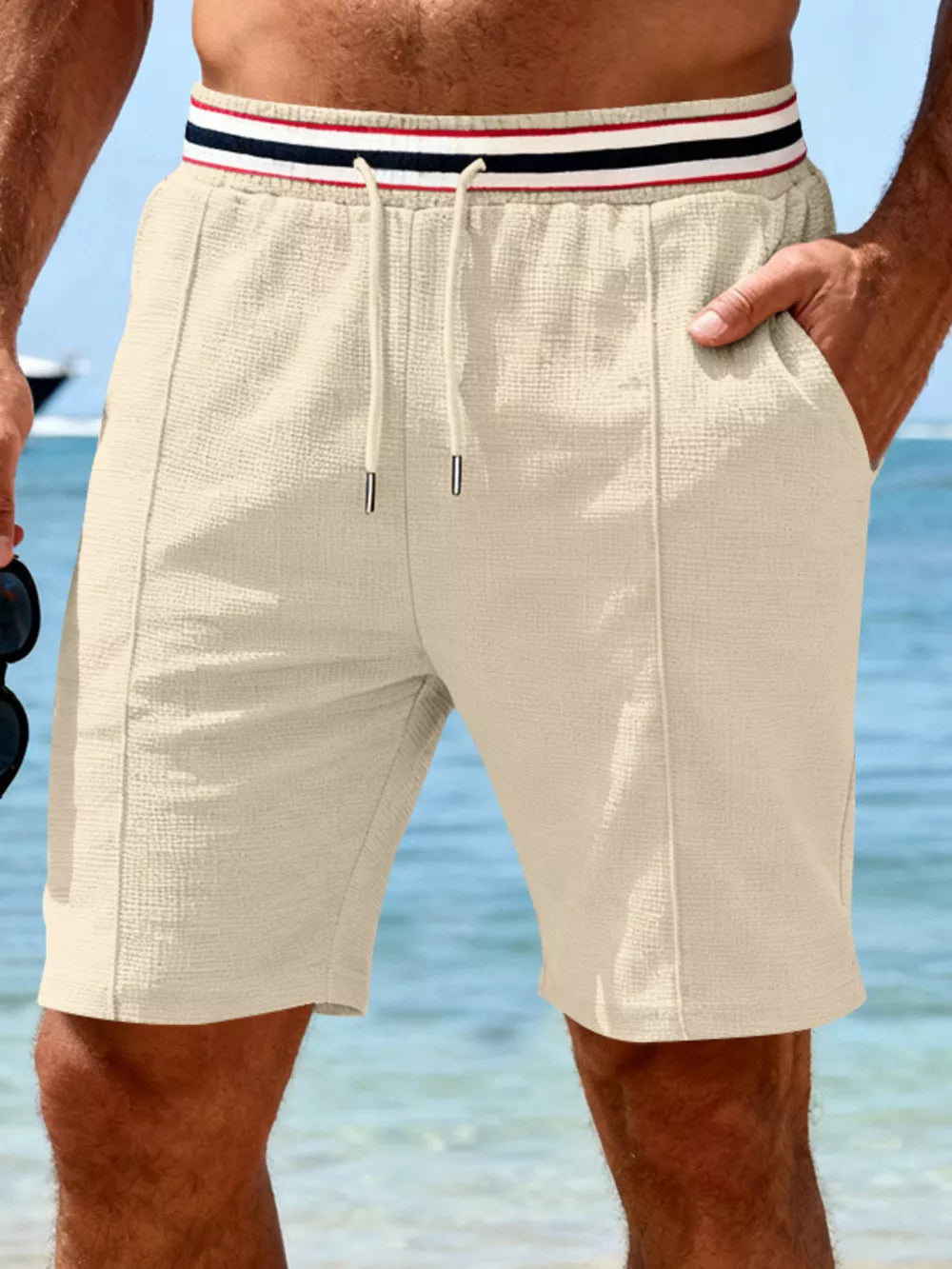 Apricot textured drawstring shorts with striped waistband and pockets