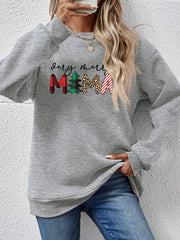 Gray crewneck sweater with "very merry mama" graphic in plaid, tree, leopard, and stripe patterns.