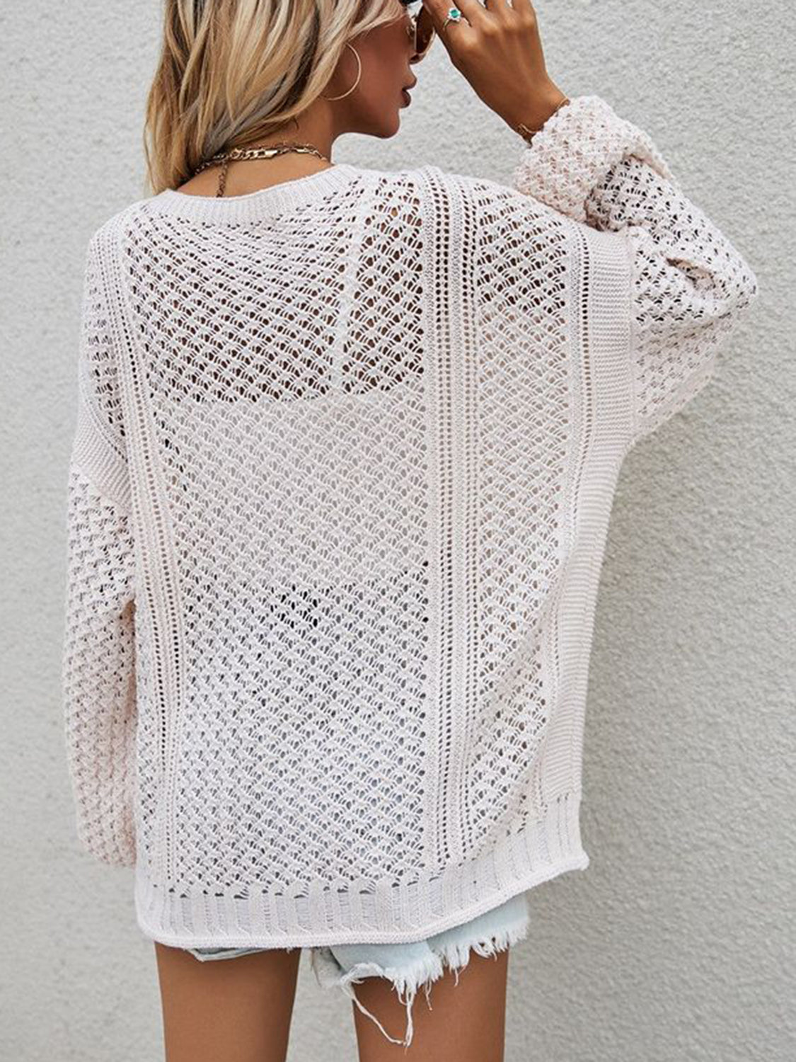 Open-knit cardigan in cream with balloon sleeves and a relaxed fit.