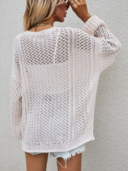 Open-knit cardigan in cream with balloon sleeves and a relaxed fit.