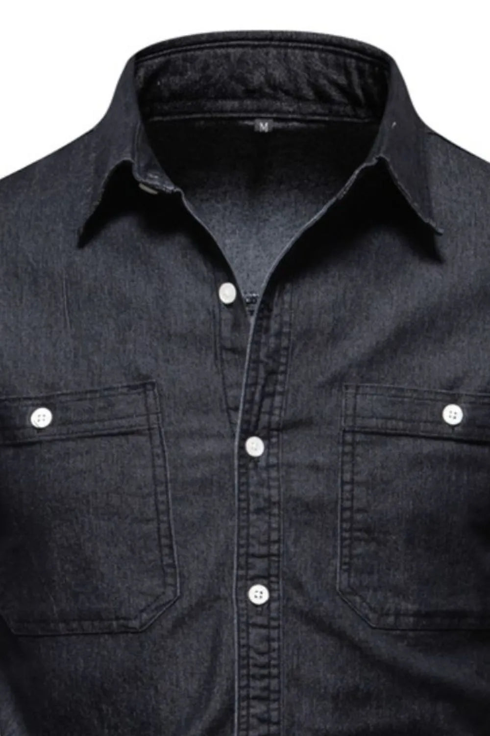 Black faded denim utility shirt with two chest pockets and white buttons.