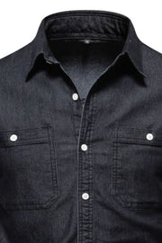Black faded denim utility shirt with two chest pockets and white buttons.