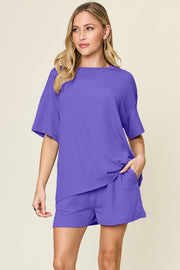 Waffle knit boxy tee and shorts set in purple with short sleeves and pockets.