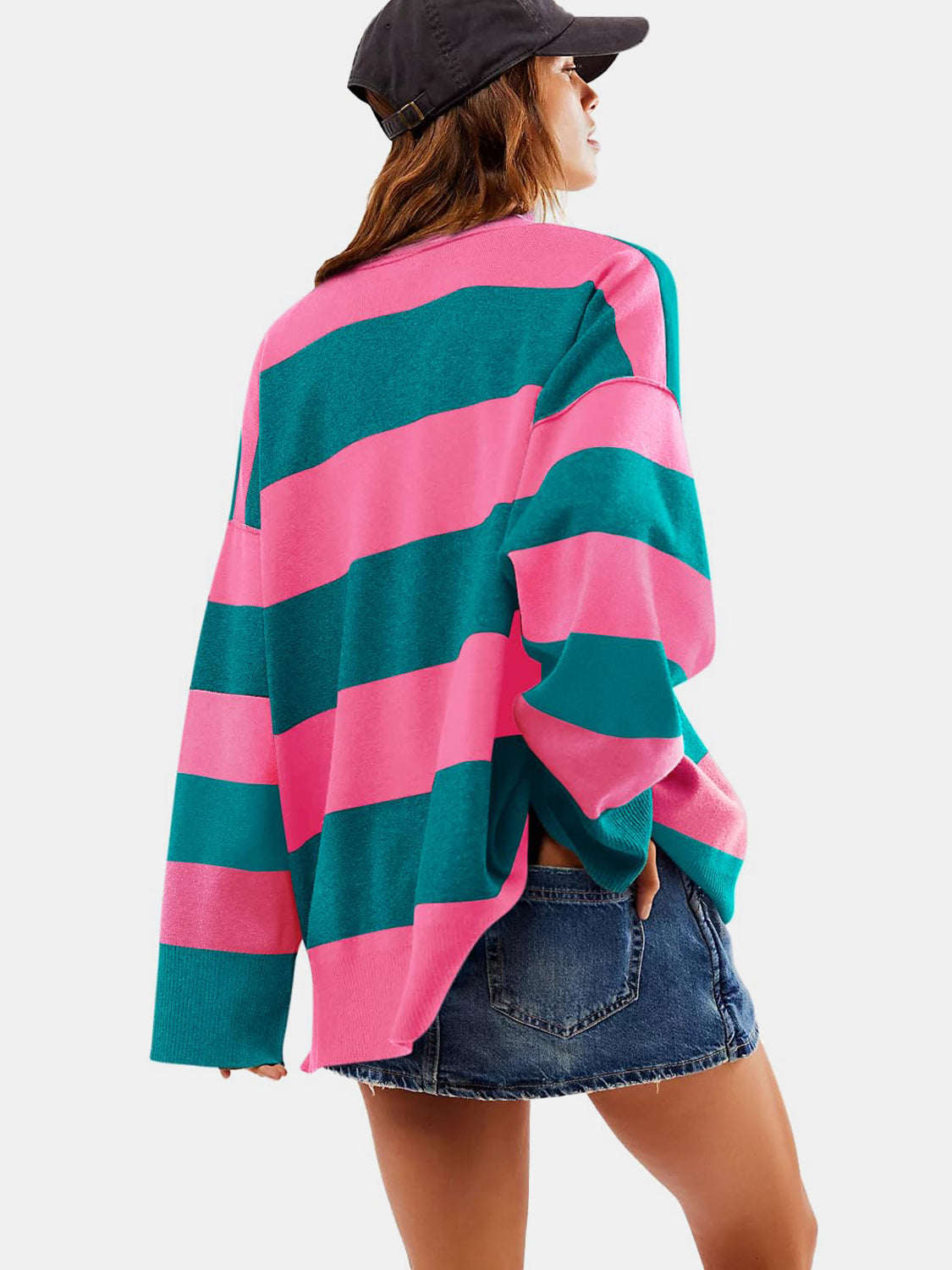 Oversized acrylic pullover with bold pink and dark green stripes, crew neck, and long sleeves.