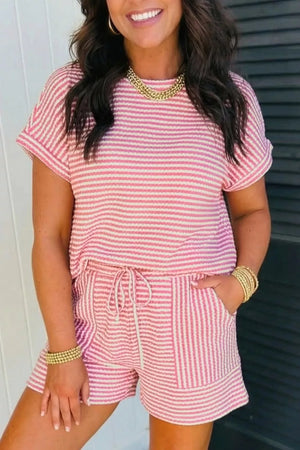 Pink striped textured knit two-piece set with drawstring shorts and short sleeve top.