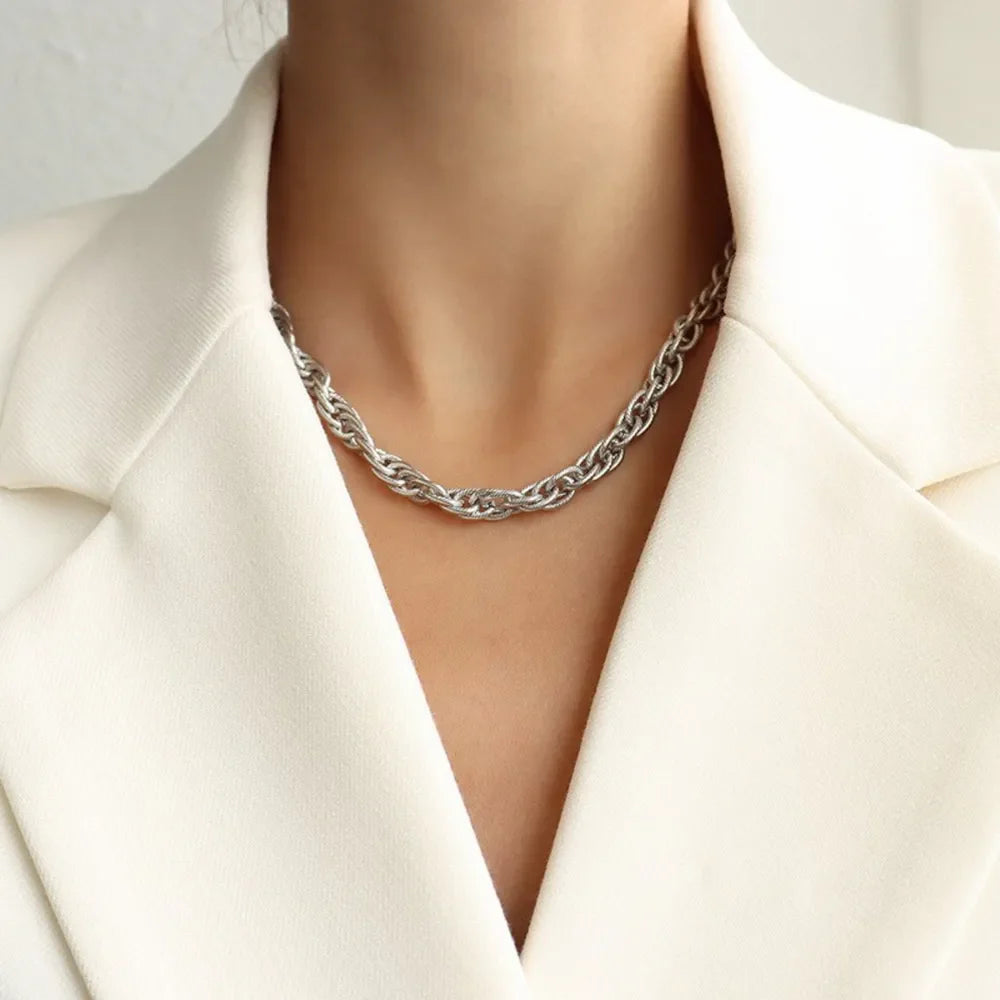 Silver textured rope chain necklace with a twisted link design.
