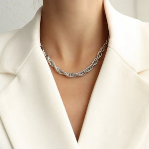 Silver textured rope chain necklace with a twisted link design.