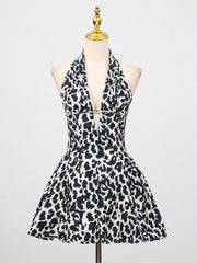 Leopard print halter neck mini dress with a deep V-neck and flared skirt.
