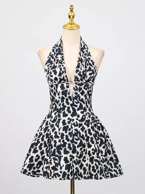 Leopard print halter neck mini dress with a deep V-neck and flared skirt.