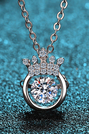 Silver pendant necklace with a crown design and a central diamond.