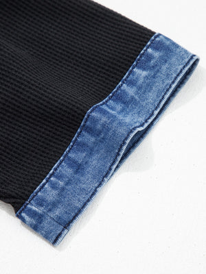 Black textured knit polo top with blue denim trim detail