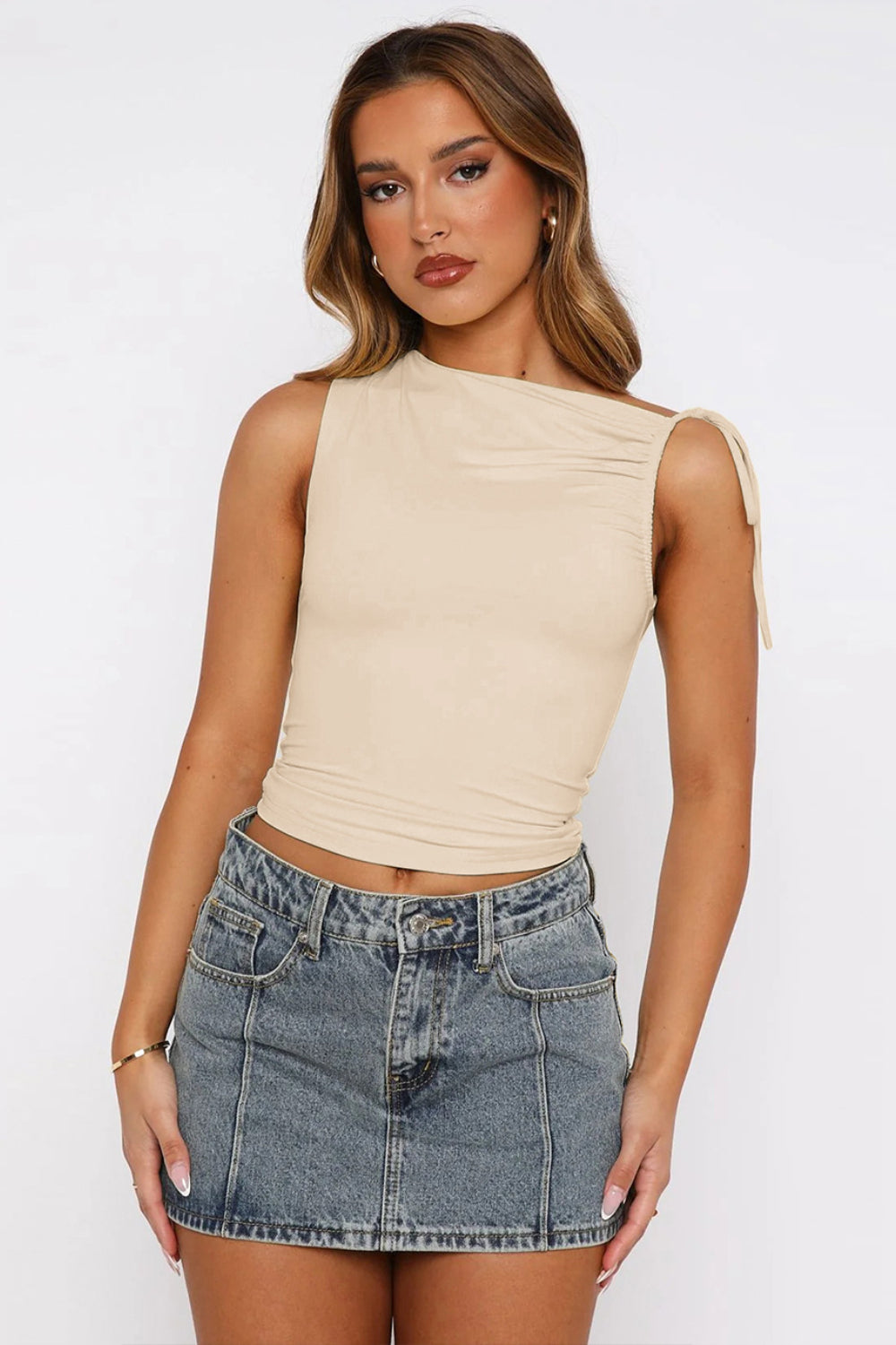 Tan asymmetric ruched tie-shoulder tank top with a flattering fit.