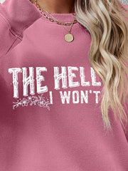 Graphic crewneck sweatshirt in Blush Pink with white text and floral detail.