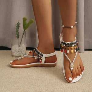 Bohemian beaded ankle strap sandals in white with colorful beads and pearl accent.