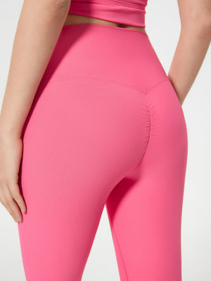 Ribbed contour cycling shorts in strawberry pink with ruched detail.