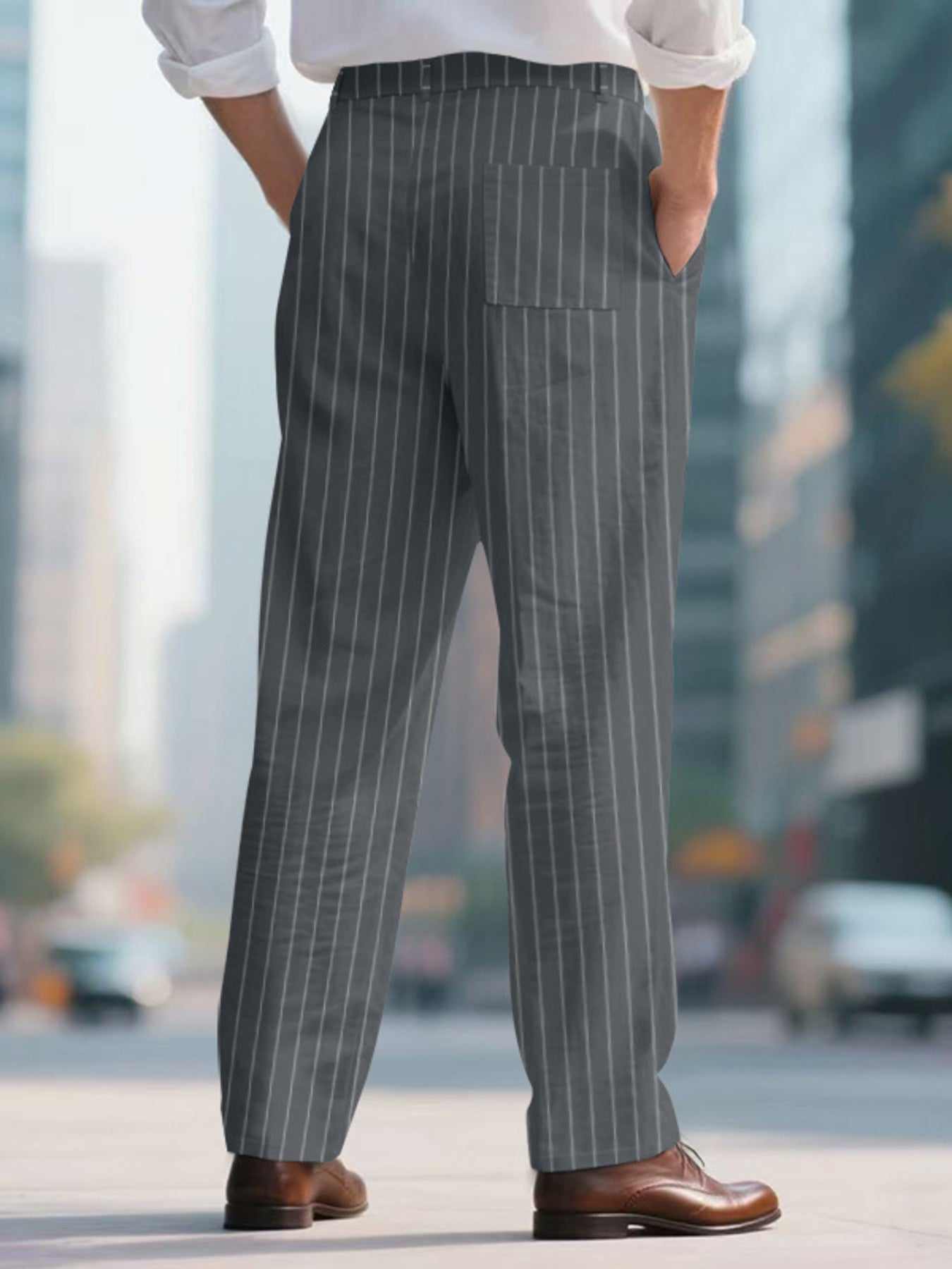 Men's grey pinstripe sweatpants with a wide-leg cut and back pocket.