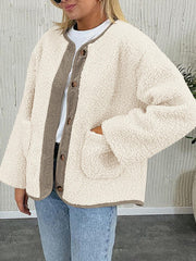 Cream teddy-texture button-up jacket with corduroy trim and pockets.