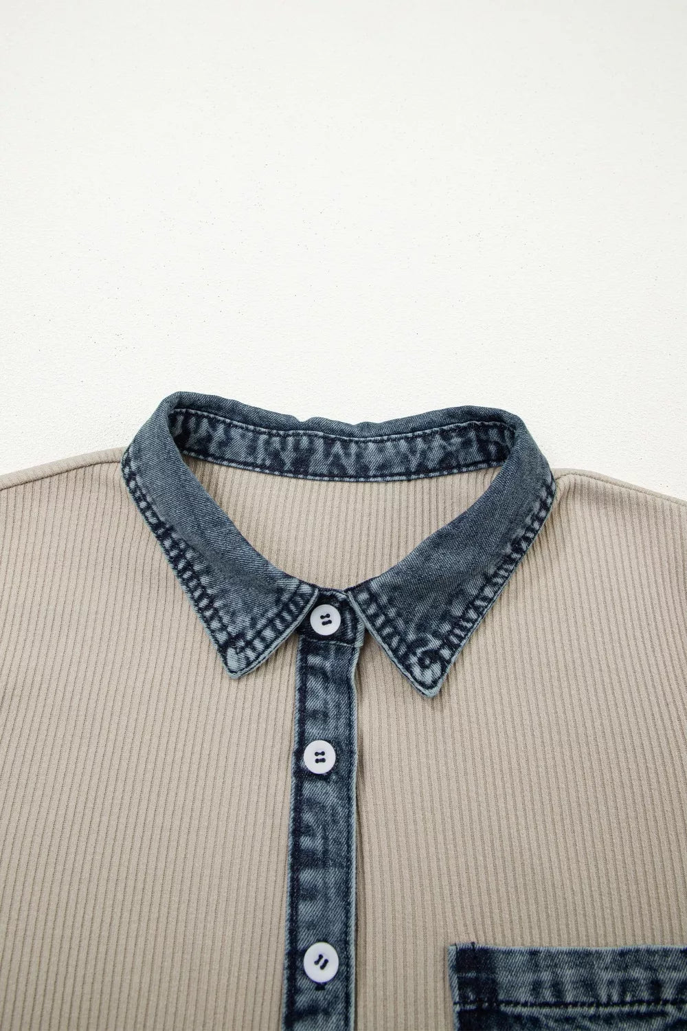 Beige ribbed knit mini dress with denim collar, placket, and pocket detail.