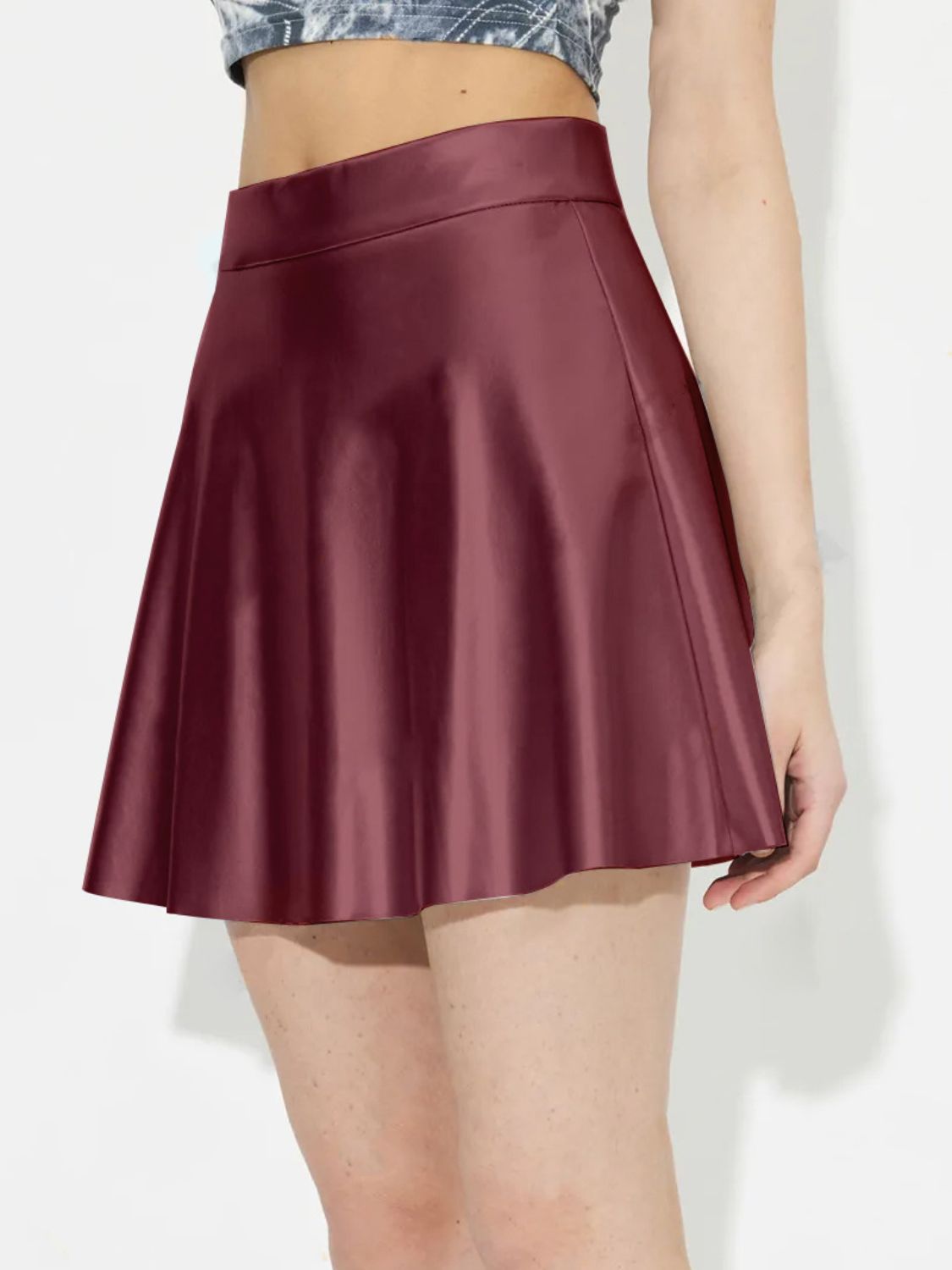 Crimson A-line mini skirt with a flared hem and high waist.