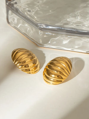 Gold dome earrings with ribbed texture, 18K gold-plated.