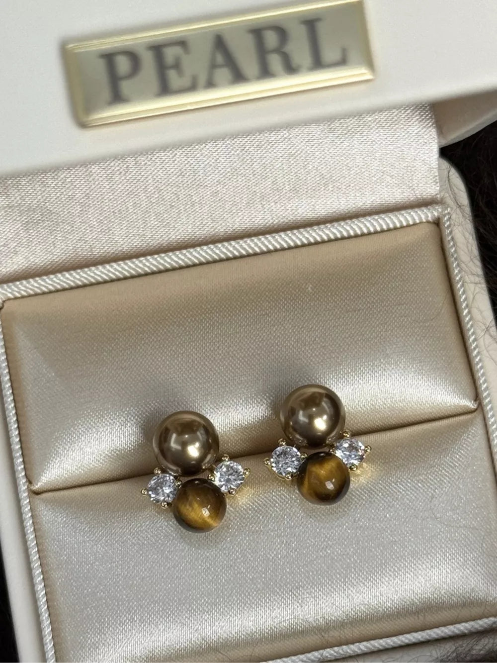 Spherical Tiger Eye Stone Stud Earrings with clear accents and pearl detail
