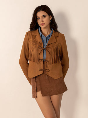 Caramel suede western jacket with fringe and tie closure, collared, long sleeves.