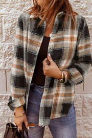 Oversized plaid shacket with button front in black and tan plaid.