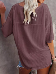 Waffle knit relaxed v-neck t-shirt in maroon with short sleeves.
