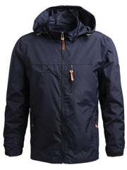 Dark blue hooded windbreaker jacket with full zip and chest pocket.